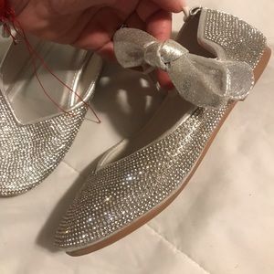 Little girls sparkly silver shoes with velcro side bow closure